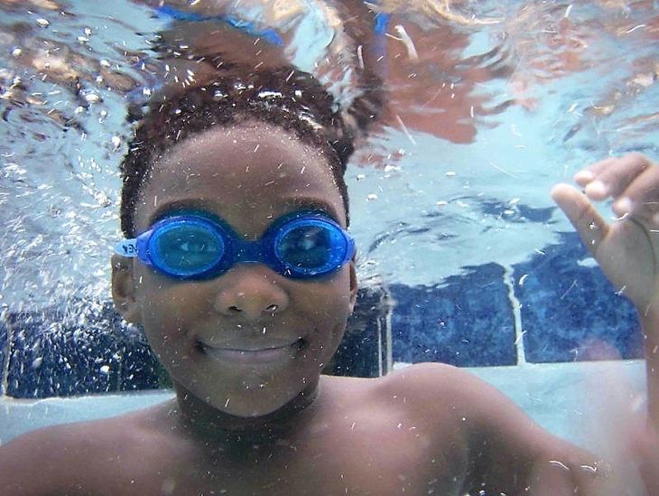 happy mcdonough ga swimmer wearing goggles at the swim center