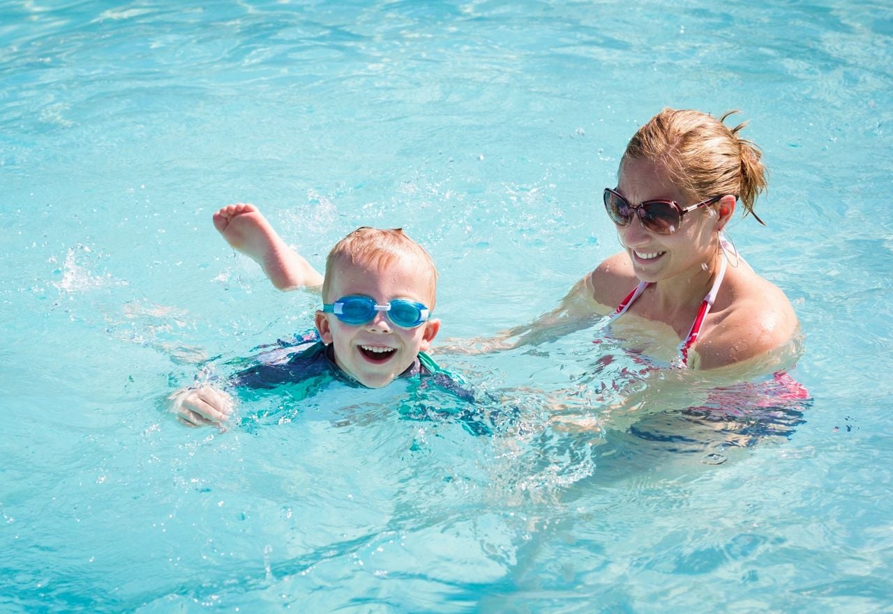 Kids learn how to swim in McDonough at The Swim Center